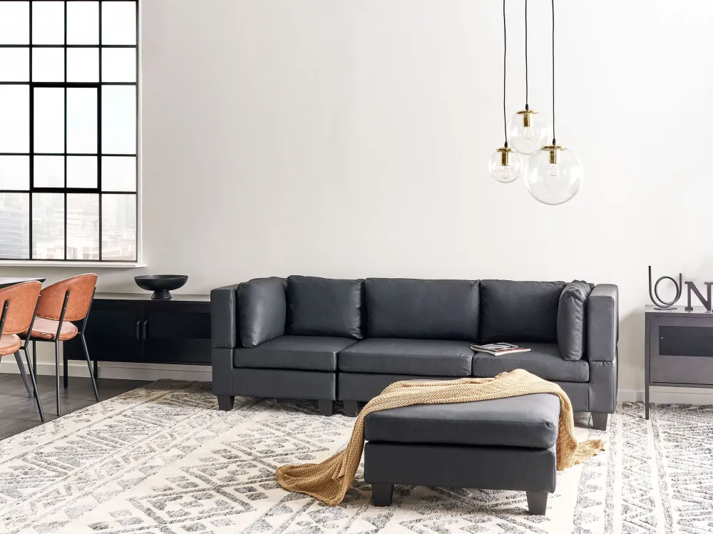 Divano modulare pelle sintetica nero 3 posti con pouf UNSTAD