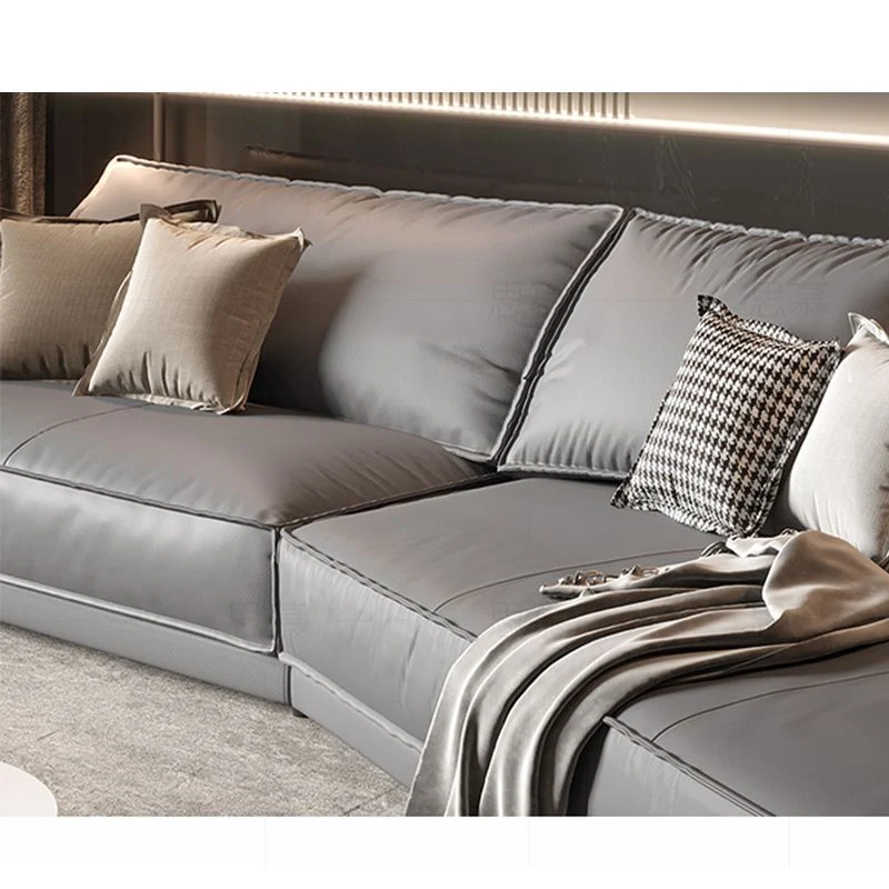 Divano curvo moderno angolare grigio chiaro componibile vera pelle per appartamento Clearhalo