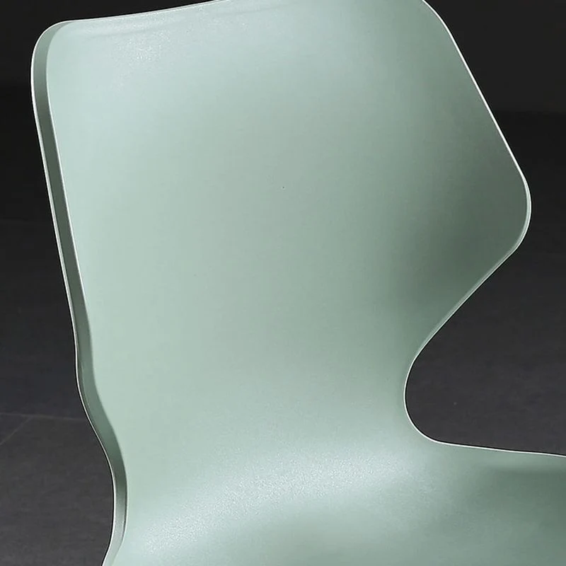 Sedia da pranzo moderna senza braccioli plastica con schienale laterale e base metallo Clearhalo