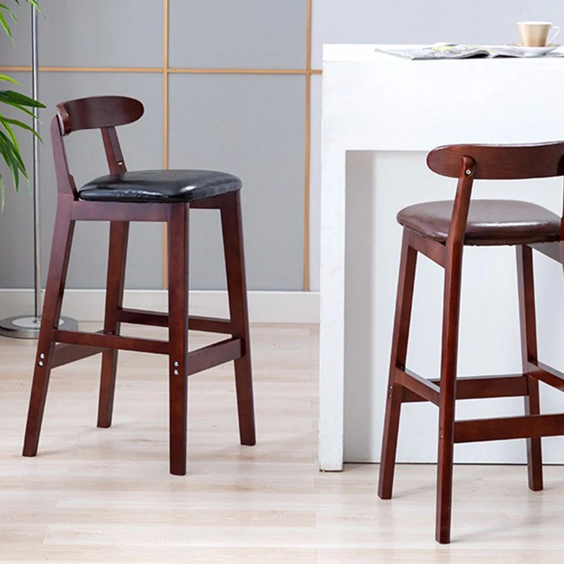 Sgabello scandinavo imbottito con poggiapiedi con schienale basso Sgabello da bar legno di gomma con finitura opaca Clearhalo