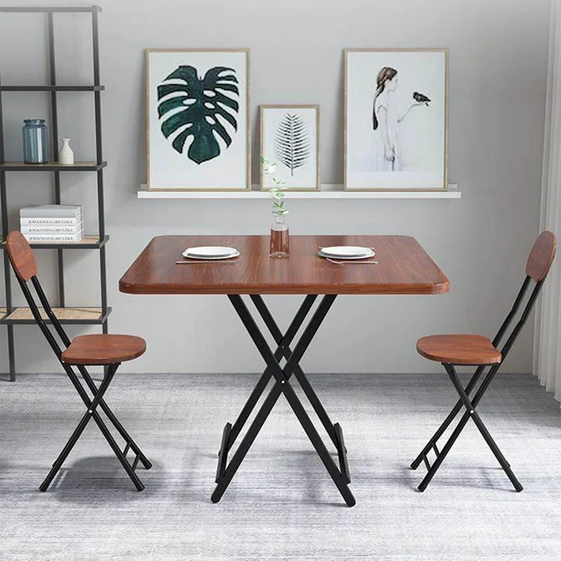 Tavolo da pranzo moderno pieghevole quadrato con piano legno e gambe metallo per la casa Clearhalo