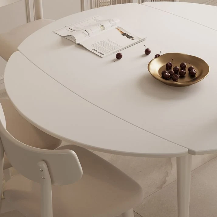 Tavolo da pranzo moderno rotondo allungabile. Piano pietra bianca con doppia anta Clearhalo