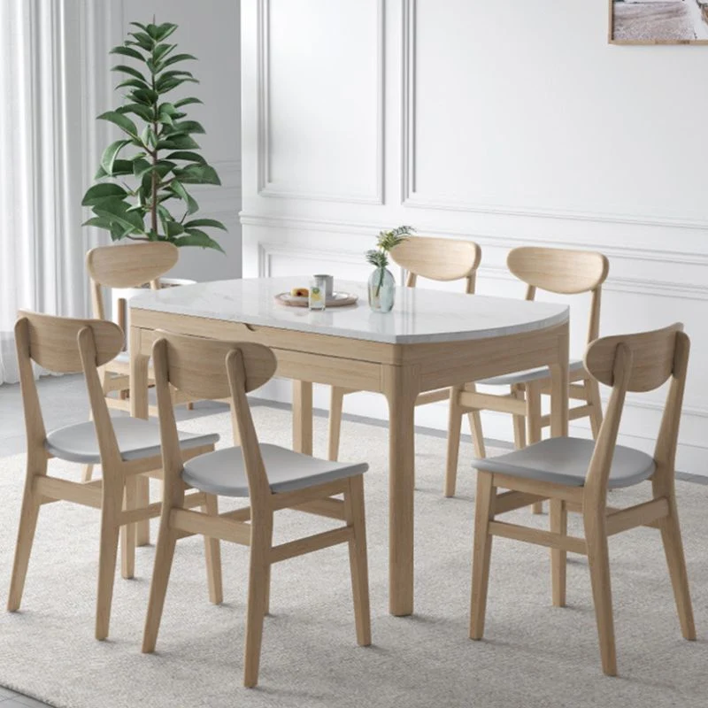 Tavolo da pranzo moderno rotondo pietra con gambe legno per la casa Clearhalo