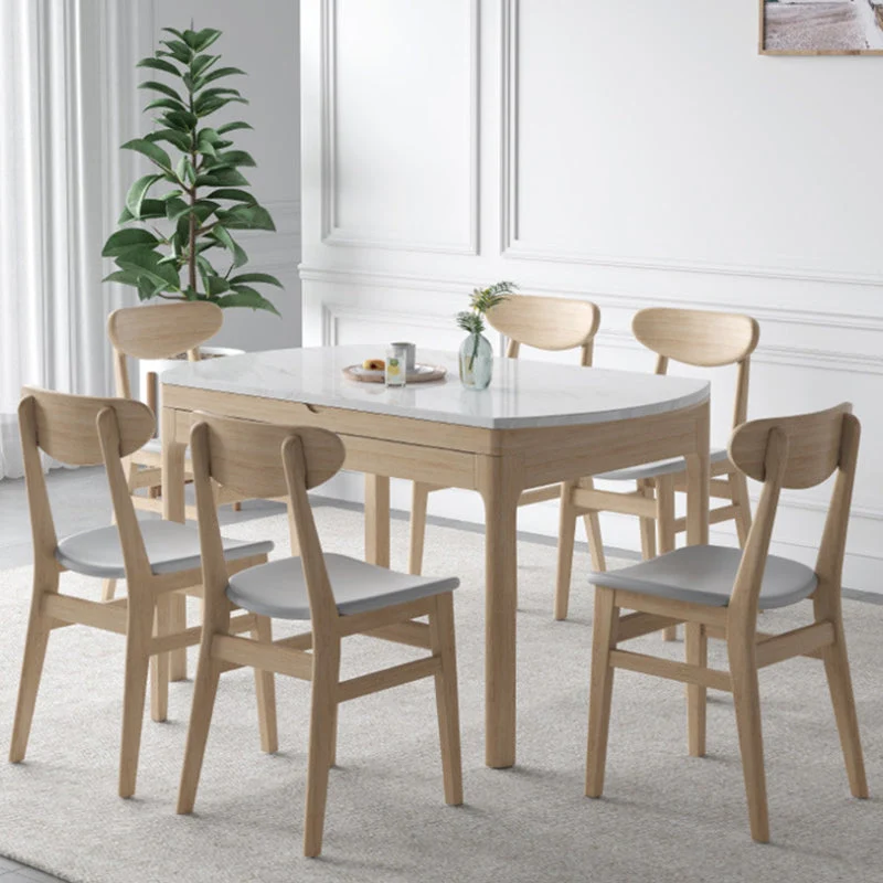 Tavolo da pranzo moderno rotondo pietra con gambe legno per la casa Clearhalo