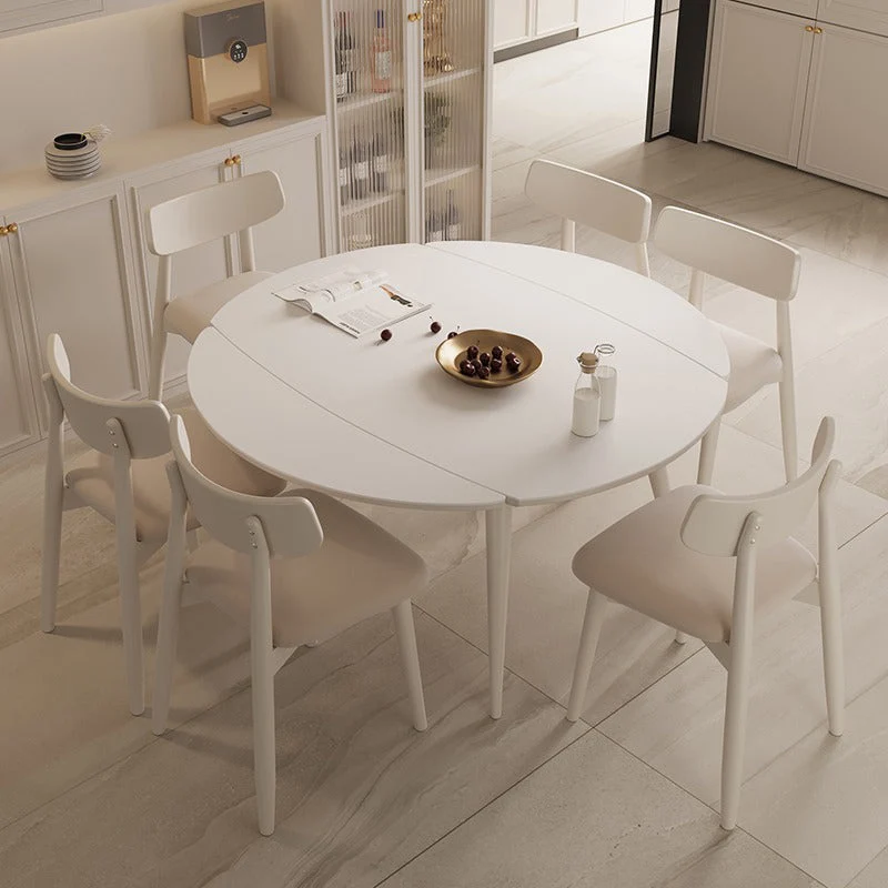 Tavolo da pranzo rotondo allungabile moderno con piano pietra bianca con doppia anta Clearhalo
