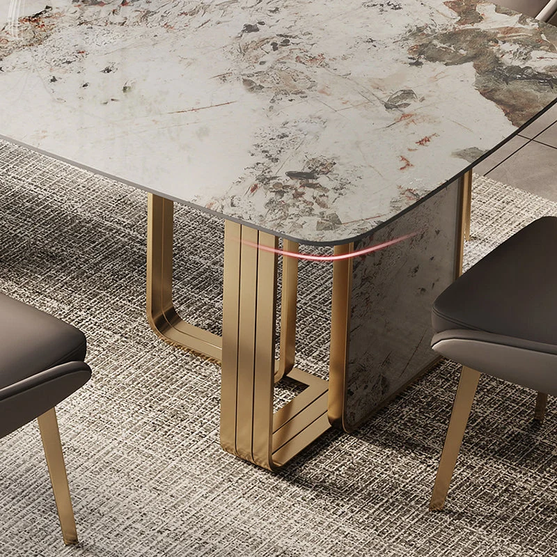 Tavolo rettangolare di lusso con piano pietra sinterizzata con doppio piedistallo metallo color oro Clearhalo